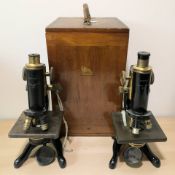Two W Watson & Sons Limited lacquered brass Service microscopes, numbered 81194 and 66433,
