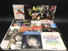 A group of vinyl LP records including Queen, David Bowie, Paul McCartney, Bruce Willis, Simply Red,