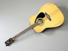 A Yamaha F-310 acoustic guitar.