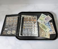 A file containing mostly early 20th century British coins including three pence pieces, halfpennies,