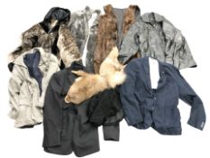 A group of fur jackets, a ferret stole, other clothing.
