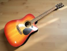 An Encore CEA255R electro acoustic guitar.