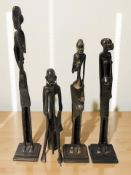 Four African bronze statues, tallest 35 cm.