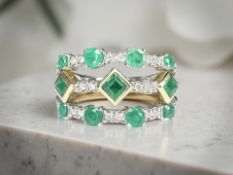 An 18ct white gold emerald and diamond ring,