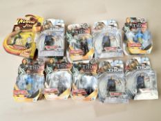 A group of Hasbro Marvel's Thor figurines and a further Hasbro Indiana Jones figurine.