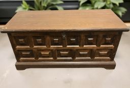 A reproduction panelled oak blanket chest, width 103 cm.