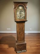 A 19th century eight day long case clock, with pendulum and two weights,