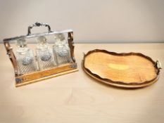 A Betjemann's Patent 8516 oak and EPNS three-bottle Tantalus, width 35 cm,