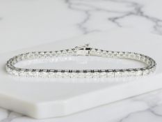 An 18ct white gold diamond tennis bracelet,