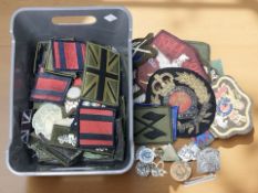 A collection of military cloth badges and insignia.