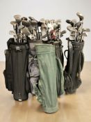 Six golf bags containing a large quantity of irons and drivers including Hippo, Dunlop,