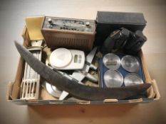 A pair of Prinz 10x50 binoculars, an aboriginal style boomerang, a Raleigh radio,