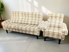 A Scandinavian three seater settee in buttoned checked oatmeal fabric,
