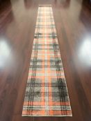 A machine made runner, 546 cm x 67 cm.