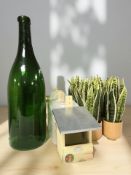 A large green glass bottle, height 75 cm, a mirror,