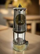 An Eccles Type GR 6 brass and chrome miner's safety lamp numbered 3522