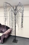 A pre-lit artificial tree, height 227 cm together with a floor standing decorative LED light,