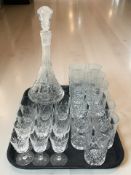 A crystal decanter and assorted tumblers, highball glasses, etc.