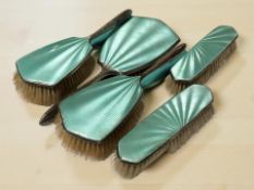 A five piece silver and turquoise guilloche enamel dressing table set, Birmingham marks,