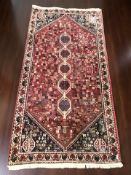 A Kashgai rug, 198 cm x 100 cm.