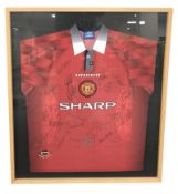 A framed and signed Manchester United football shirt, size L, 1996-98 home shirt,