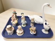 Eight Royal Albert Beatrix Potter figurines, a Lladro swan No. 5230, and a Lladro goose.