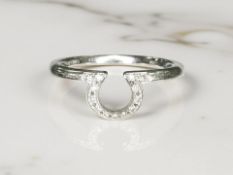 An Omega 18ct white gold diamond set ring, signed to inner shank and numbered 42448 57,