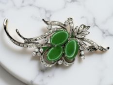A jade and diamond brooch/pendant,