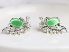 A pair of jade and diamond earrings,