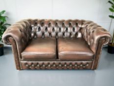 A Chesterfield style buttoned brown leather two seater settee,
