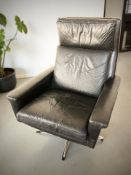 A Scandinavian black leather armchair on chrome legs