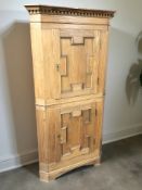 A continental panelled oak corner cabinet, height 173 cm.