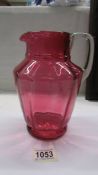 A nice cranberry glass jug, no cracks or chips, 20 cm tall.