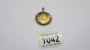 An 18ct gold religious pendant featuring Mary, 7.83 grams.