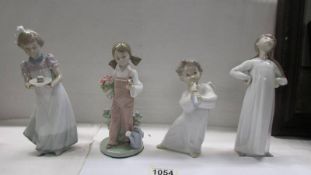 Four boxed Lladro figures.