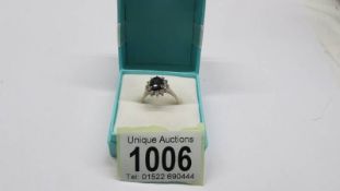 An 18ct gold oval sapphire and diamond ring, size P half, 4.26 grams.