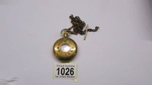 A half-hunter pocket watch on chain.