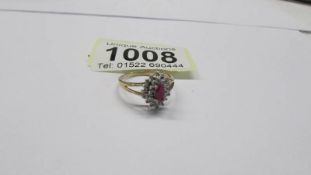 A yellow gold ruby and diamond ring, size L. 1.78 grams.