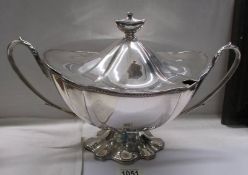 A magnificent twin handled silver plate soup tureen.