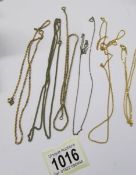 Five yellow metal and one white metal chains.