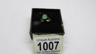 An 18ct gold jade ring, size P, 302 grams