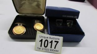 A pair of Swarovski crystal cuff links and a pair of Shah of Persia coin cuff links.