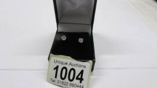 A pair of 80pt diamond studs set in white gold.