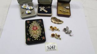 A mixed lot including enamel cross, bar brooch, locket, orchid brooch with matching earrings