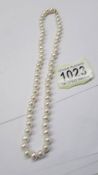 A strand of pearl with a 9ct gold clasp.