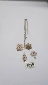 Four art deco 9ct gold pendants, one with attached 9ct gold chain, 15.45 grams.