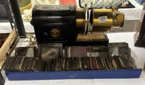 A Victorian magic lantern with a quantity of glass slides
