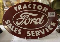 A reproduction Ford tractor sales service oval enamel sign 30 x 20cm