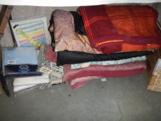 A quantity of bedlinen including eiderdowns.