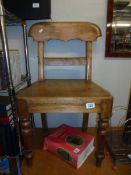 A Victorian mahogany hall chair.